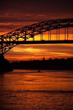 bridge with golden orange sky at sunsetの写真素材