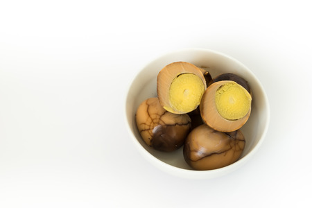 Tradional chinese herbal eggs in a white bowlの写真素材