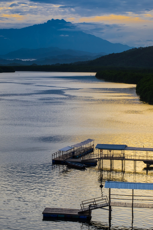 Vew of Mengkabong river and Mt Kinabalu from Mengkabong bridge.の写真素材