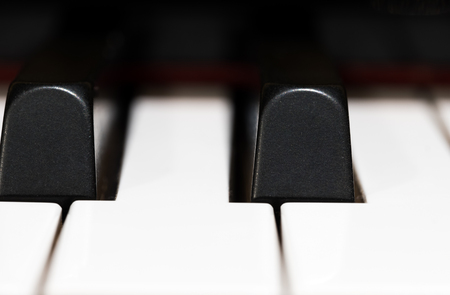 Close up view of acoustic piano keysの写真素材