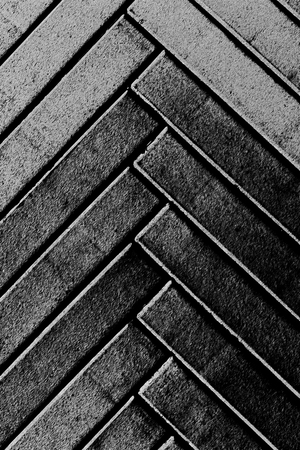 Grey narrow herringbone pattern stylised bricks background vertical compositionの写真素材