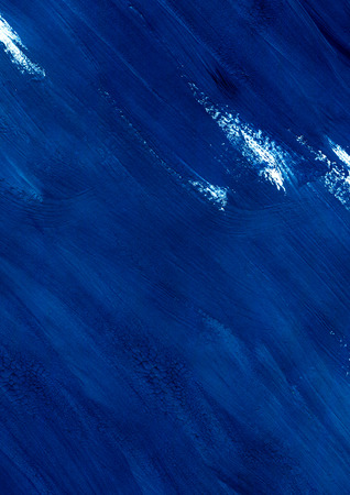 Abstract blue acrylic gouache hand painted background. Isolated on white background. Close up. Can be used for print: bags, t-shirts, home decor, posters, cards.の写真素材