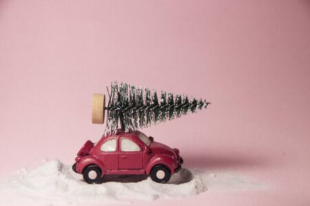 Car deliver Christmas spruce tree. new year holiday background with copy spaceの写真素材