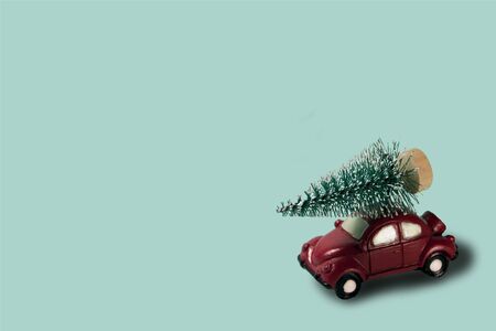 Car deliver Christmas spruce tree. new year holiday background with copy space for seasonal designの写真素材