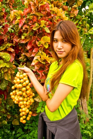 Burmese grape and girl in Thailandの写真素材