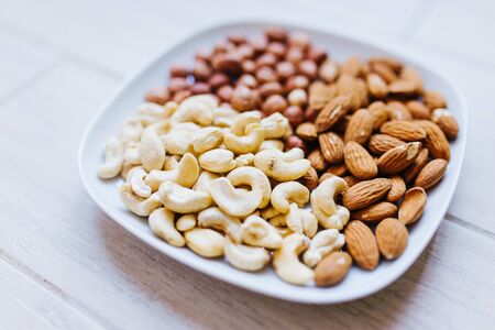 assorted nuts on a decorative plateの写真素材