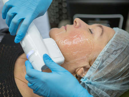 Non-surgical face lifting. SMAS lifting ultrasonic. The process of rejuvenation. Hardware...