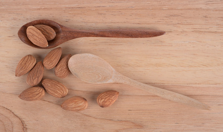 Almonds  on the wooden floorの写真素材