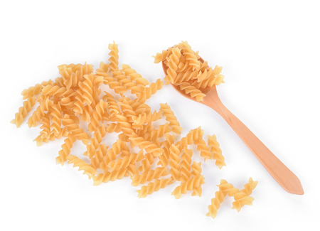 yellow pieces of macaroni isolated on white backgroundの写真素材