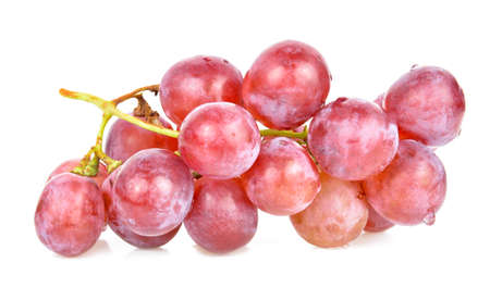 Purple grapes isolated on whiteの写真素材