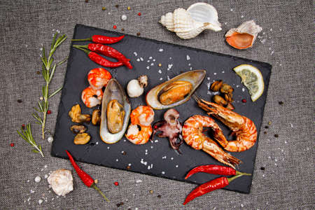 plate of crustacean seafood with mussels, hrimps, oysters as an ocean gourmet dinnerの写真素材