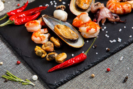 plate of crustacean seafood with mussels, hrimps, oysters as an ocean gourmet dinnerの写真素材