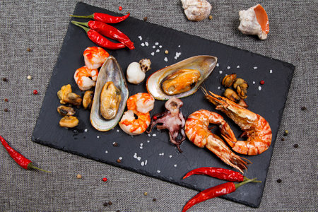 plate of crustacean seafood with mussels, hrimps, oysters as an ocean gourmet dinnerの写真素材