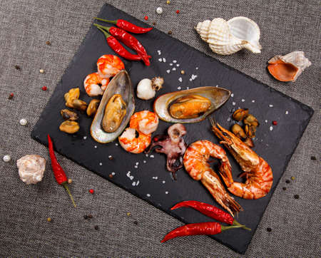 plate of crustacean seafood with mussels, hrimps, oysters as an ocean gourmet dinnerの写真素材