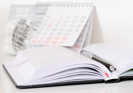 Pen on an opened diaryの写真素材