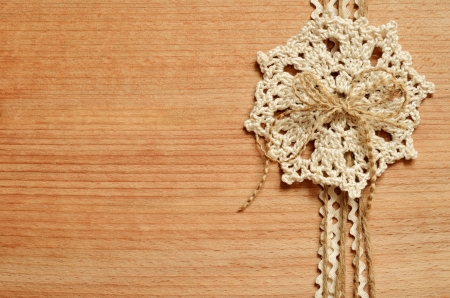 Wooden background with crochet compositionの写真素材