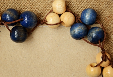 Wooden beads with card on canvas backgroundの写真素材