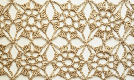 Beige crochet lace on white backgroundの写真素材