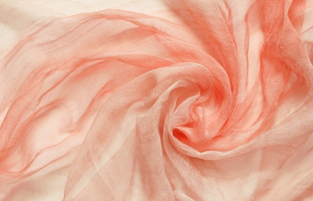 Peach viscose fabric with circular drapery for backgroundの写真素材