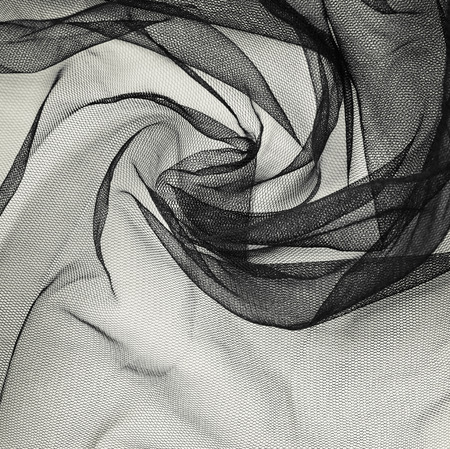 Black tulle background with draperyの写真素材