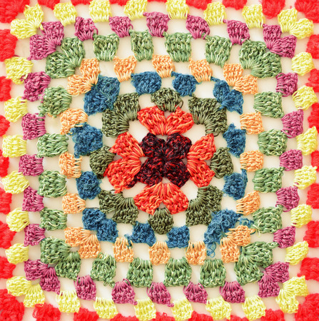 Closeup of colored crochet square for background