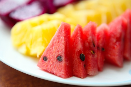 image of fresh watermelon slices on white plateの写真素材