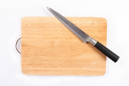 Knife and chopping board isolated on white background 