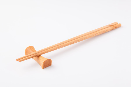 Wooden chopsticks isolated on white backgroundの写真素材