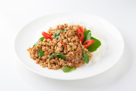 stir-fried with minced pork and basil on white plate (Ka Prao Moo)の写真素材