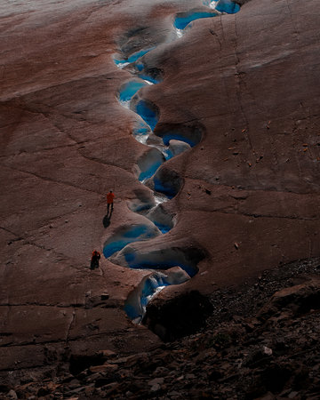 Climbing to the blue lake along the slope of the Aktru glacier.の写真素材
