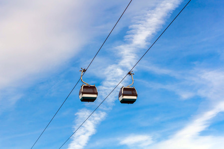 Cable cars on blue sky background in Lisbon, Portugalの写真素材