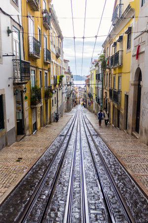 Old street in Lisbon after rain, Portugal. November 30, 2016のeditorial素材