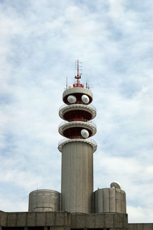 A modern communication tower with microwave and satelite dishesの写真素材