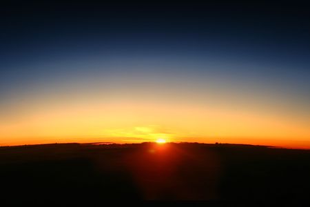 The appears on a new day showing the curve of the earthの写真素材