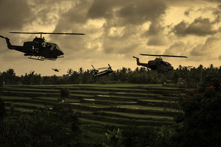 Vietnam War 'style' image circa 1970 helicopters flying over South Vietnamese rice paddies looking for the North Vietnamese Army. (Artist's Impression)の写真素材