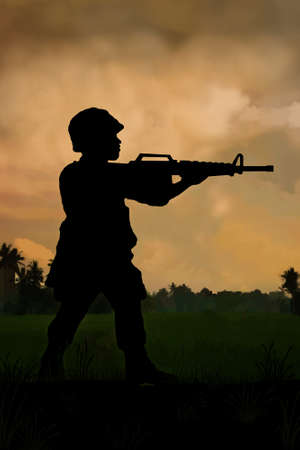 Silhouette of American special forces soldier on patrol in therice paddies and jungle of Vietnam. (Artist illustration)の写真素材