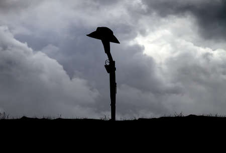 Silhouette of Australian ANZAC soldiers against the sky.(Artist drawn silhouette on photo background)の写真素材