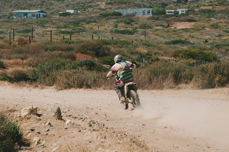 Motorcyclist Riding Dirt Bike in Mexicoの写真素材