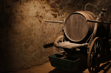 Wooden old wine machine in dusty old basement.