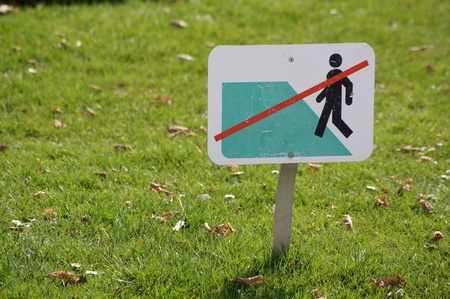 Don't step on the grass sign.の写真素材