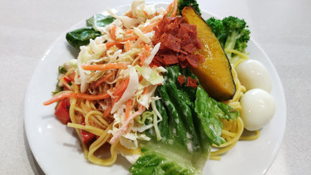 fresh vegetable salad on white plateの写真素材