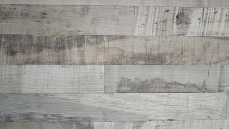 Rough and uneven wood surface, cracks in the woodの写真素材