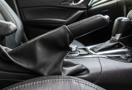 Detail of new modern car interior, Focus on hand breakの写真素材