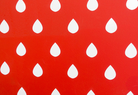 White shiny water drop on red background. illustrationの写真素材