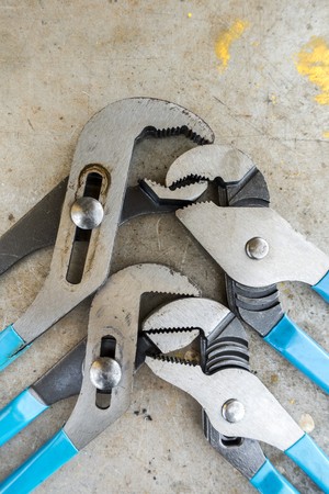 Mechanic tools on scratched background