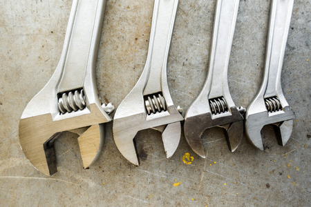 Mechanic tools on scratched backgroundの写真素材