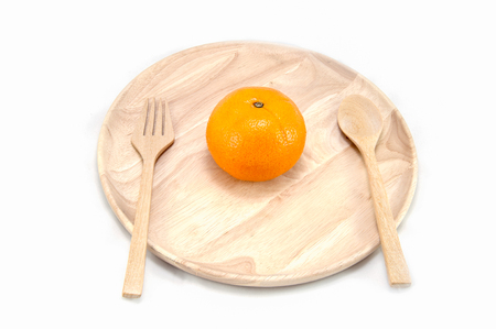 orange in a wood dishの写真素材