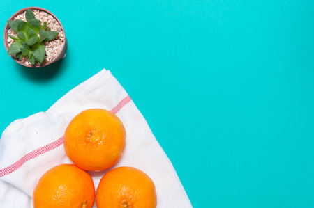 Fresh orange fruits and juice on marble table.の写真素材