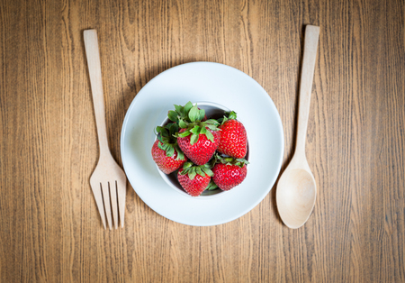 Fresh strawberry and juice on wood table. flat lay.の写真素材