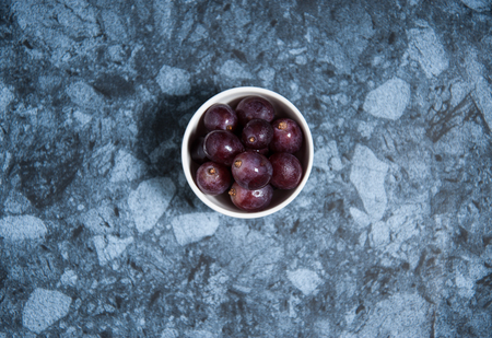 Fresh grape fruits on marble table. Flat lay.の写真素材